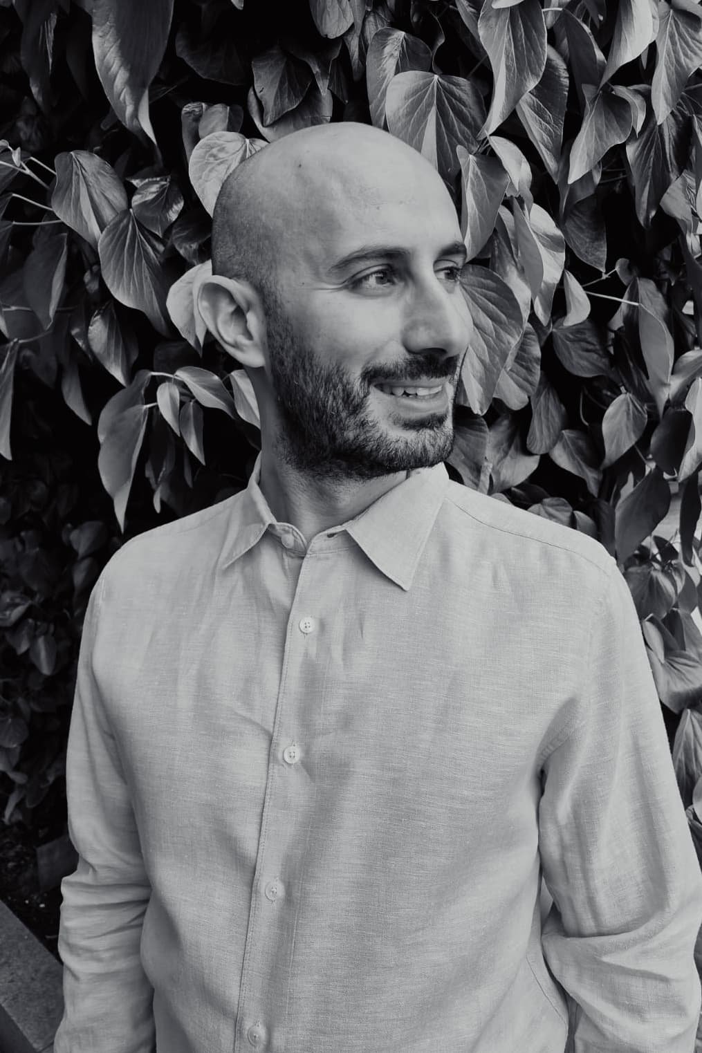 Simon smiling whilst looking to the side