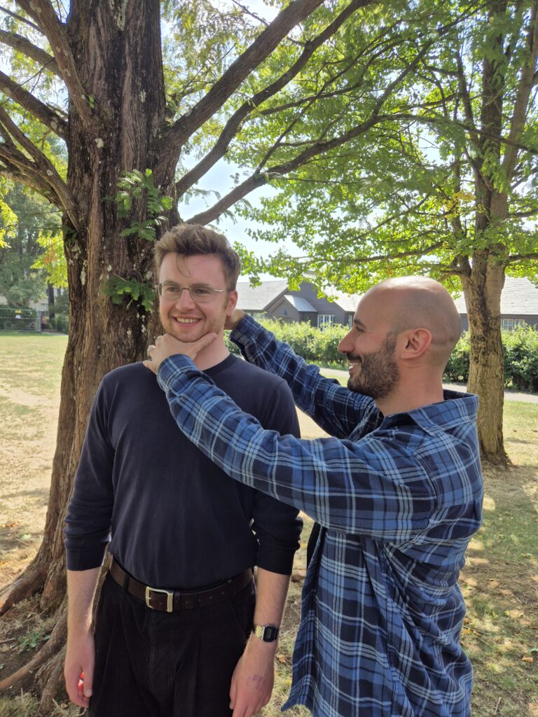 Simon working with a young man